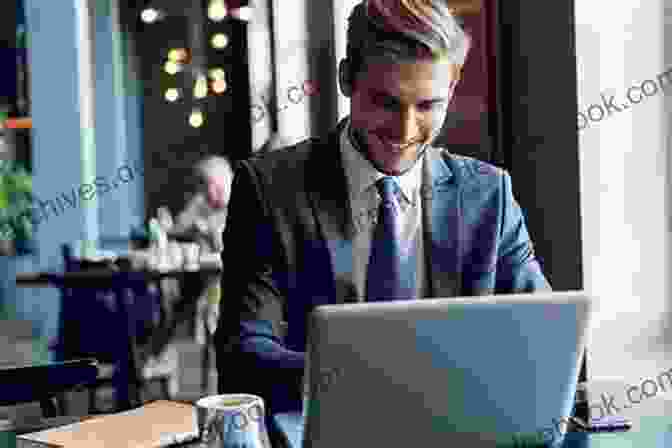 A Businessman Looking Determined While Working On A Laptop Staying Lean: Thriving Not Just Surviving Second Edition