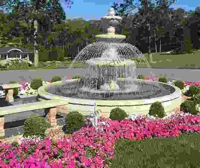 A Colorful Faience Fountain With Intricate Geometric Patterns And A Flowing Water Feature, Nestled Amidst Vibrant Flowers French Provincial Furniture And Accessories For Interiors And Gardens: Lamps Clocks Faience Porcelain Tole And Other Metalwork Garden Fountains Sculptures And Other Ornaments