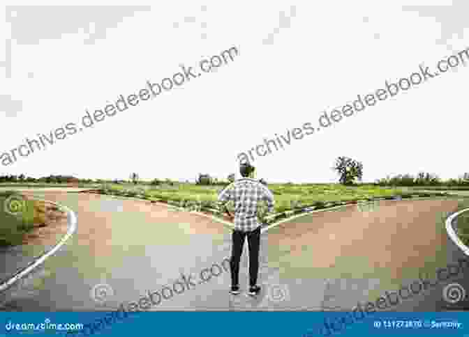 A Young Man Standing At A Crossroads, Looking Ahead At The Road Ahead. A Curve In The Road